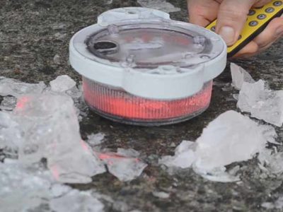 The OL2A solar hazard marker still flashes after being freed from an ice block